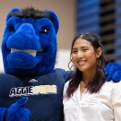 UC Davis mascot poses with a recent alum 