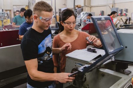 Two students working at the engineering student design center