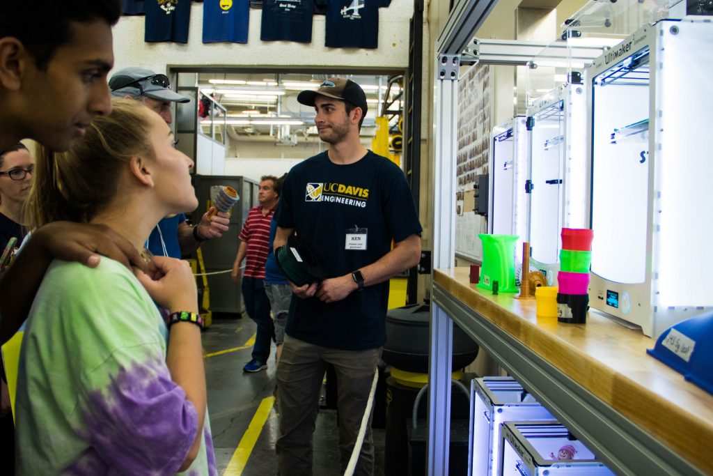 Visitors observe the 3-D printers