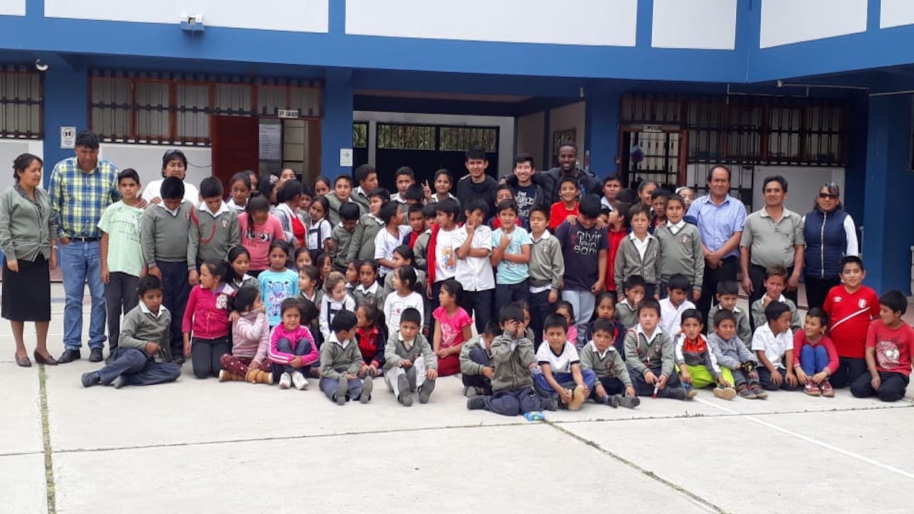 A group photo of UC Davis students and the children and staff from La Huaylla’s elementary school. Courtesy photo.