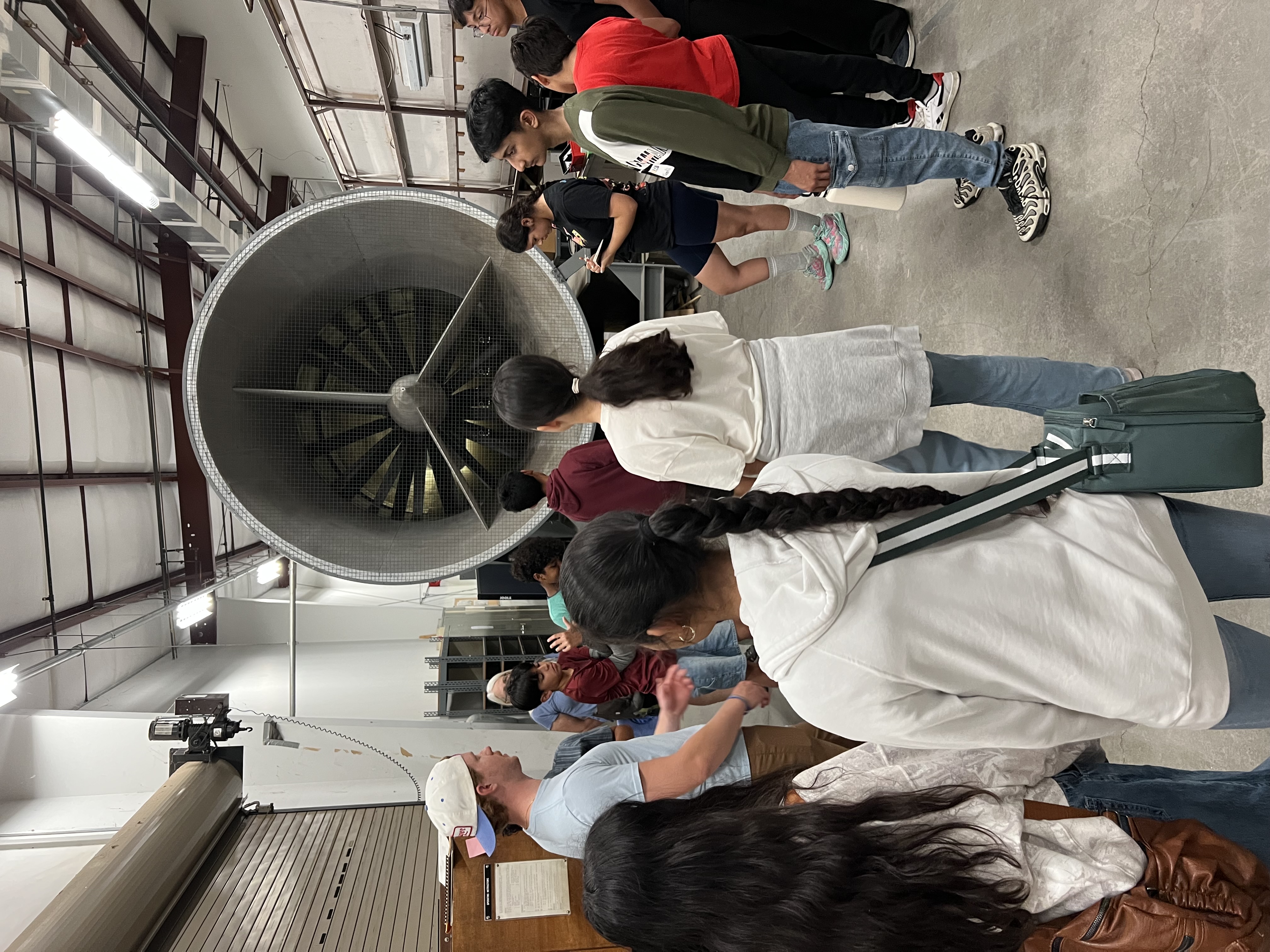 Students tour a wind tunnel to learn about aerodynamics