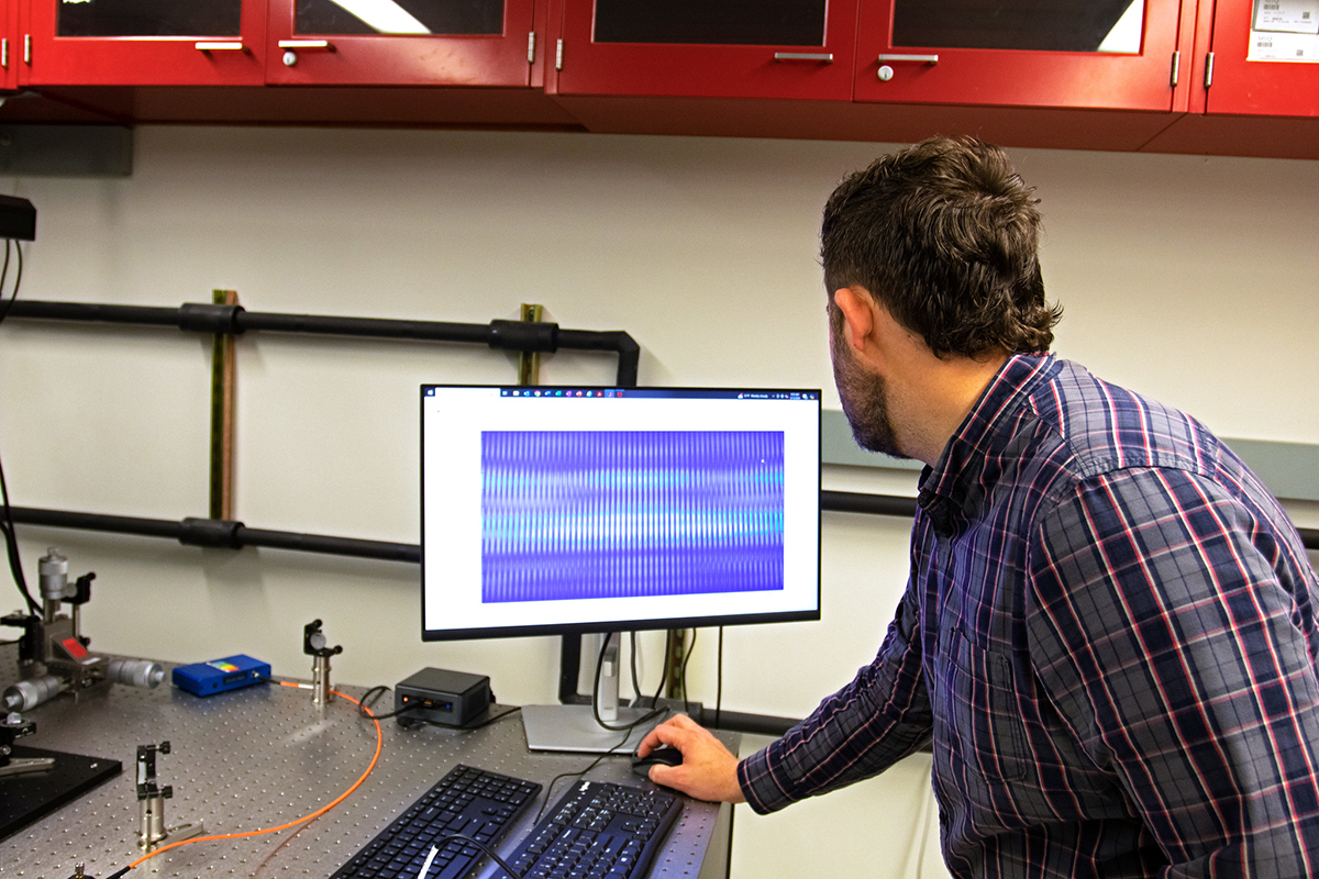Glick reviews data on a computer screen