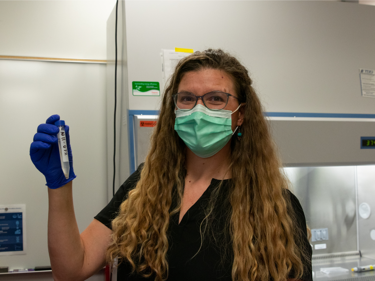 Assistant professor Heather Bischel with a wastewater sample