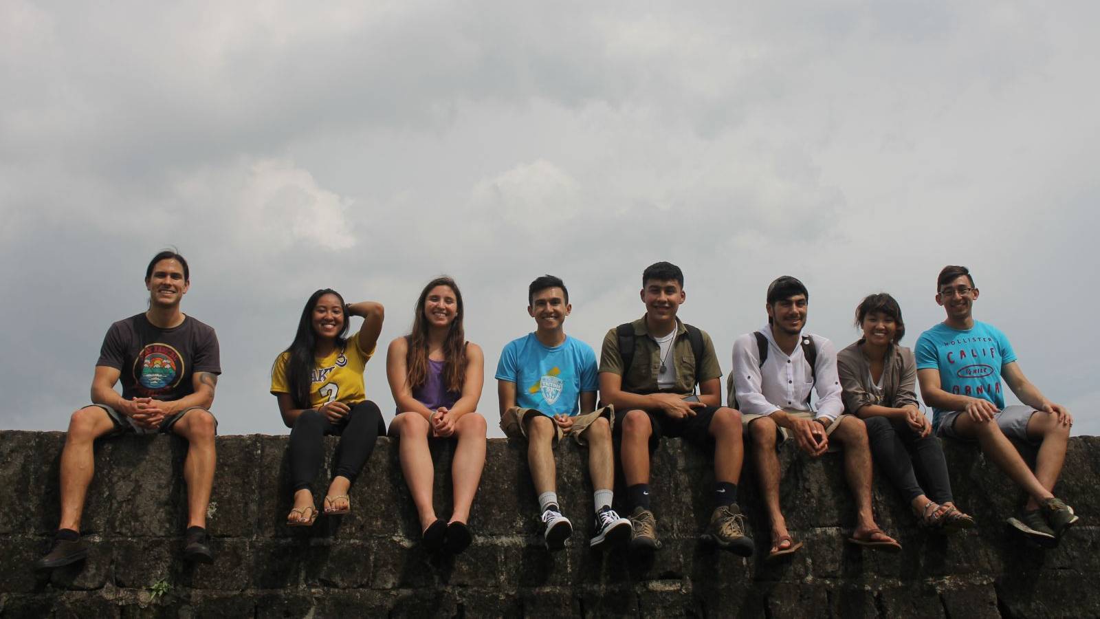 students on the One Village Philippines team sitting