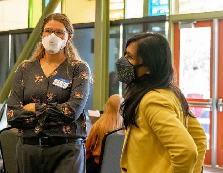 Image of Heather Bischell and Priya Shah at the PEACE Conference