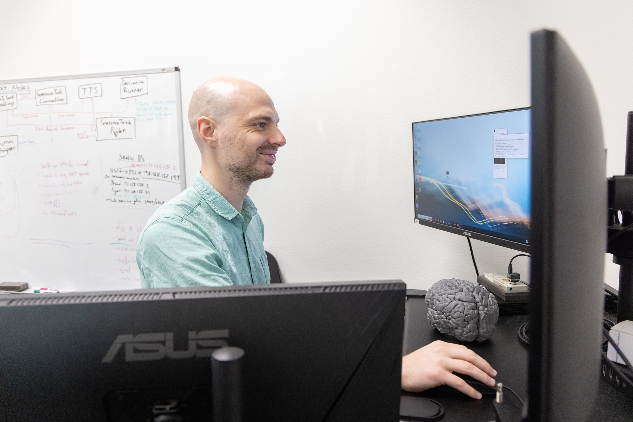 Tyler Singer-Clark works in the Neuroprosthetics Lab