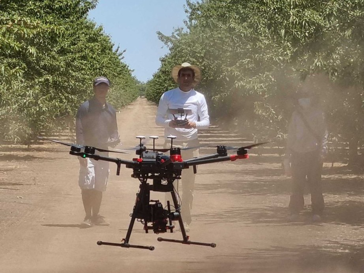 Farmer flying a drone