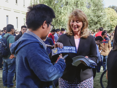 Dean Jennifer Curtis passing out College of Engineering stickers