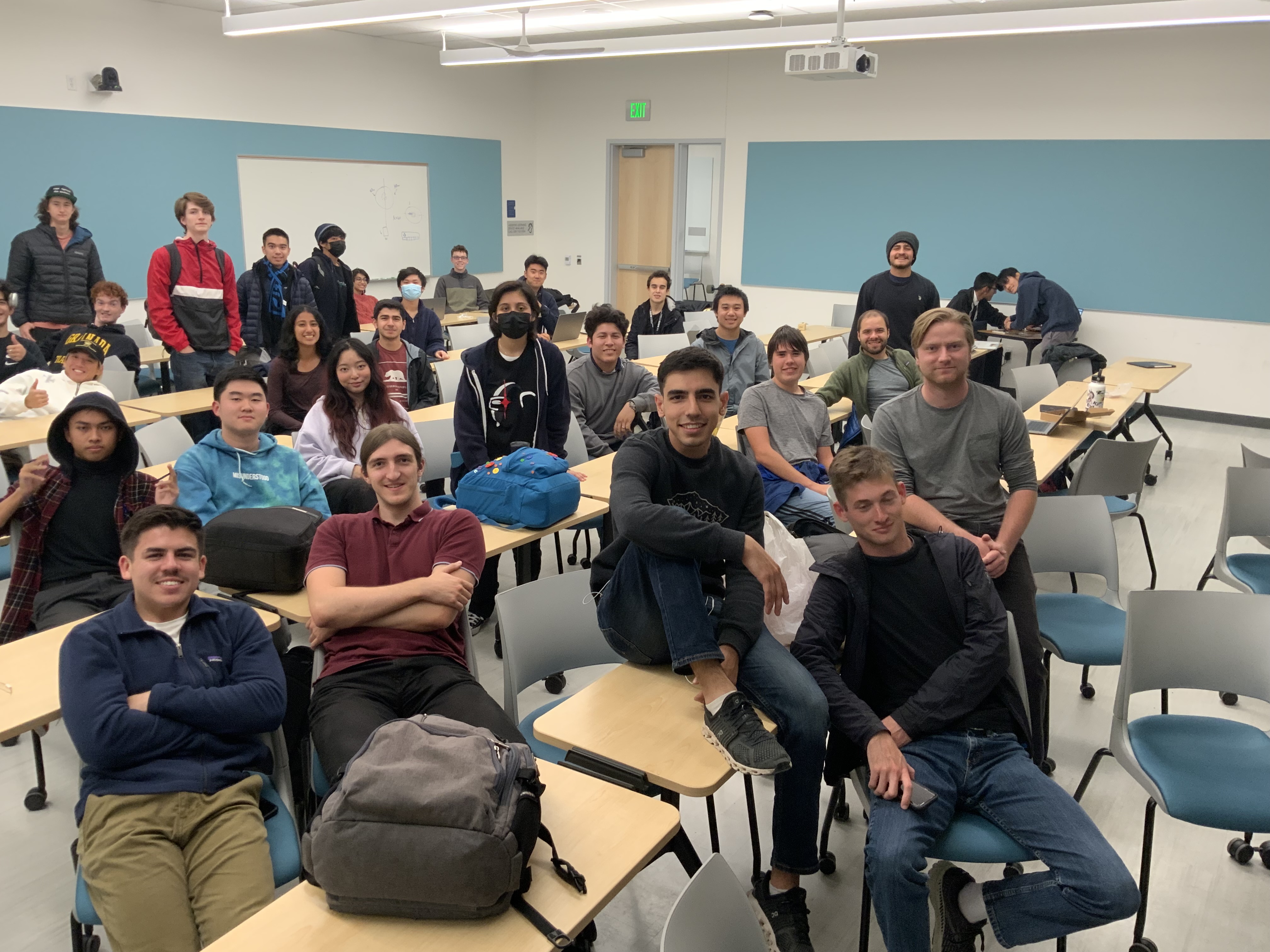 Many Aggie Propulsion Laboratory students sit in a classroom for group photo