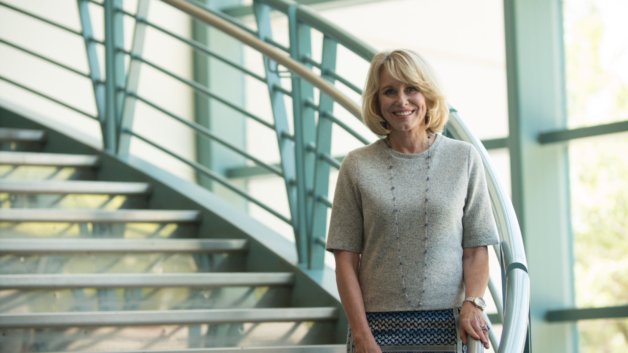 Diane Bryant (’85) on the spiral staircase of Kemper Hall