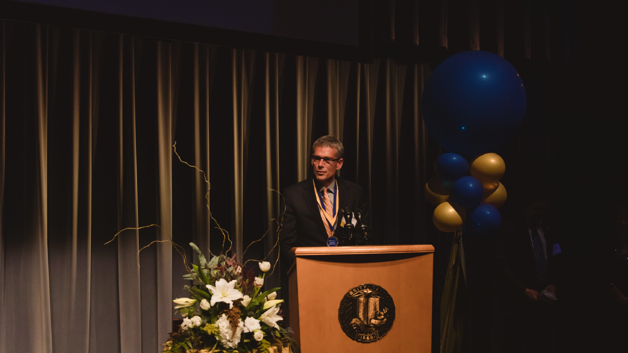 Michael Hurlston speaking at the 2019 Alumni Celebration