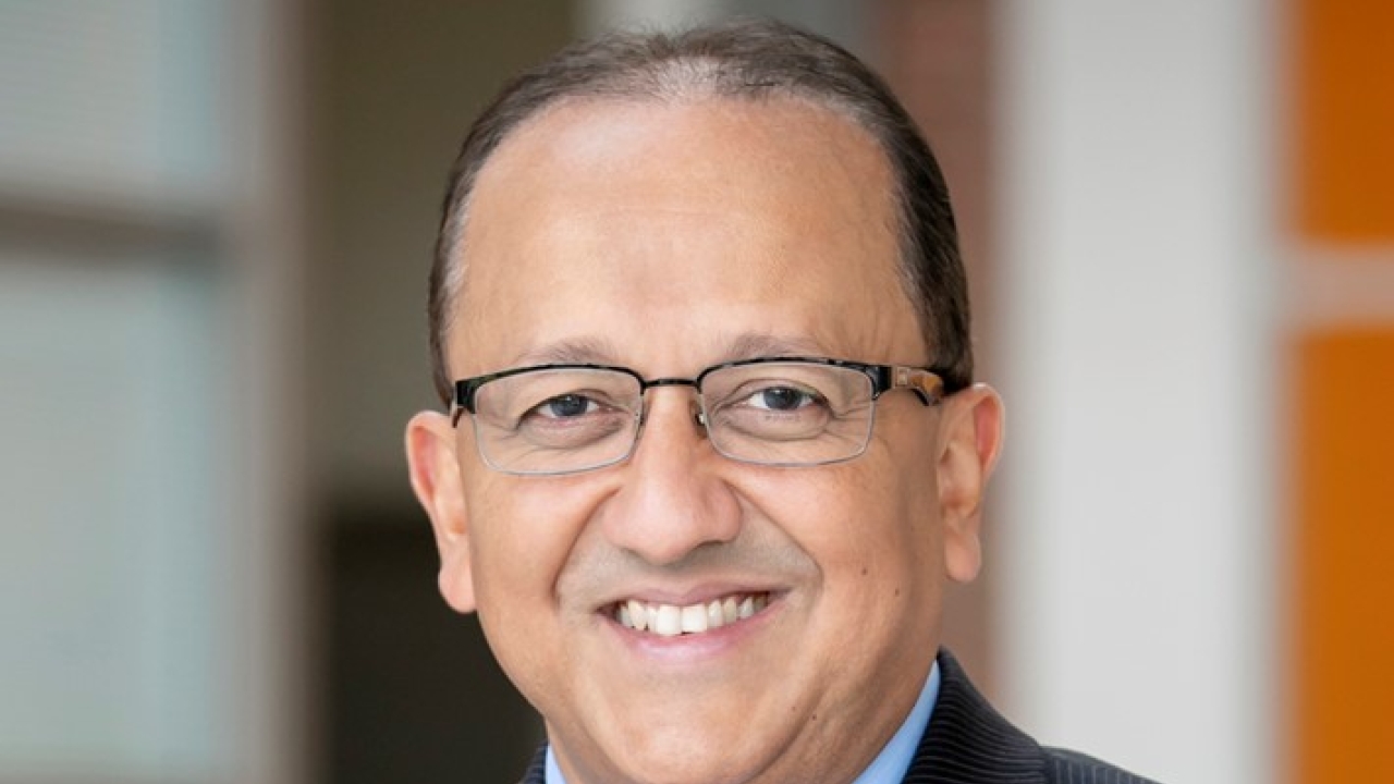A portrait of Rashid Bashir in a suit