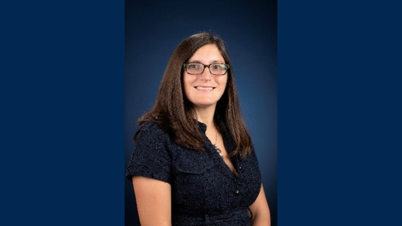 Dr. Christine King on blue background