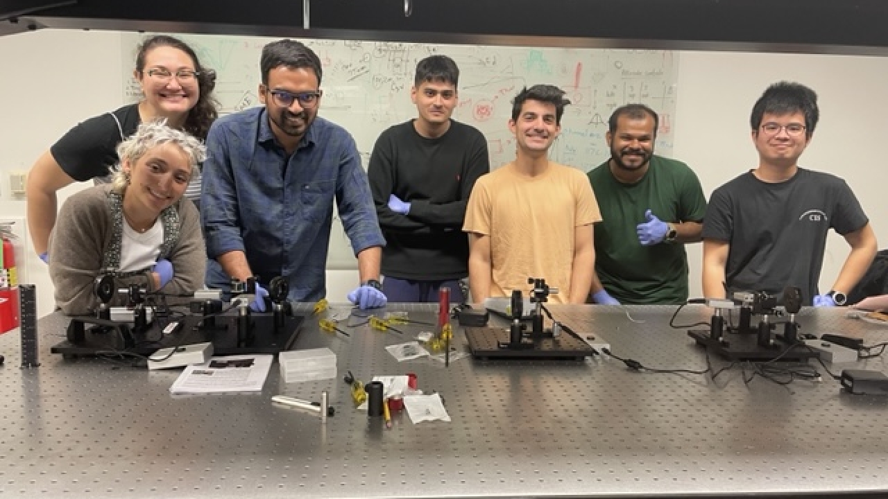 Group of UC Davis students pose in a lab