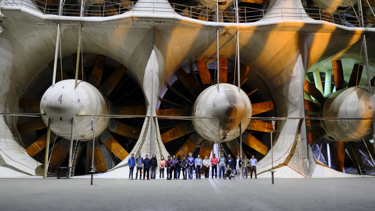 Society stands in front of the rotors of the largest wind tunnels in the world