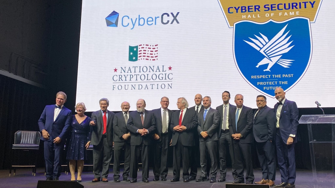 Matt Bishop, center, stands with his fellow 2023 honorees at his induction into the Cyber Security Hall of Fame. (Courtesy Cyber Security Hall of Fame)