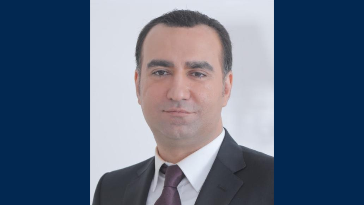 Mohsen Habibi in a dark suit and tie