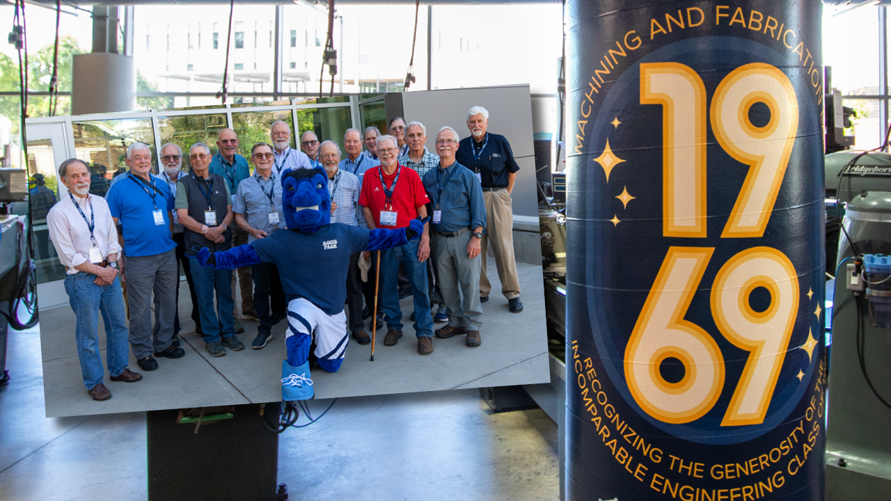 Pillar with 1969 logo on it and group of alumni with Gunrock mascot