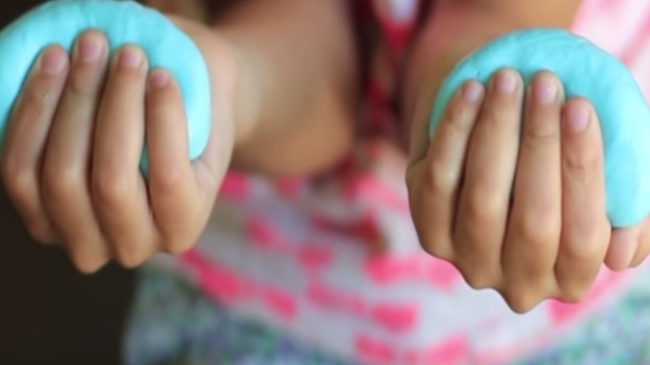 photo of child's hands with silly putty