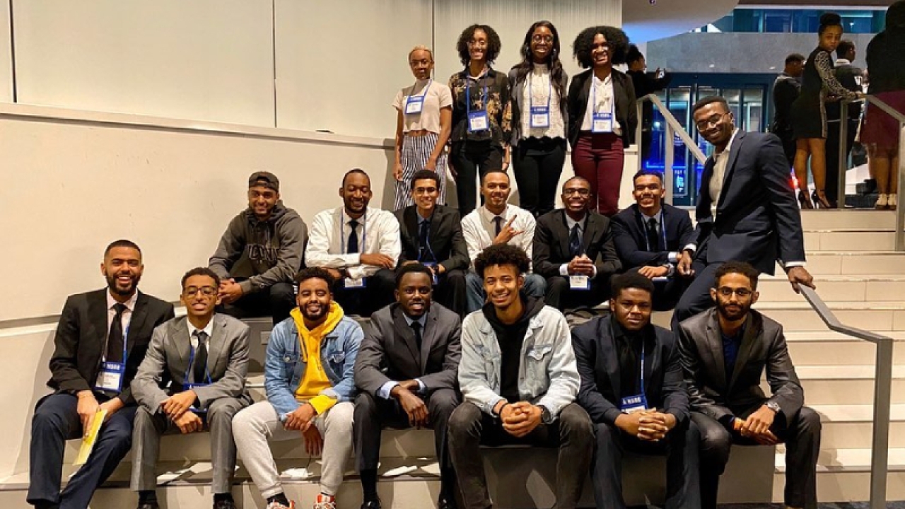 Members of the BEA posing during a conference