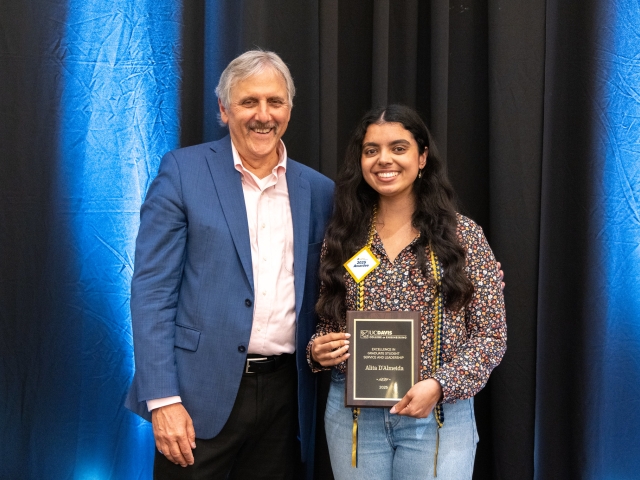 Grad student stands with Dean of UC Davis Engineering Rich Corsi