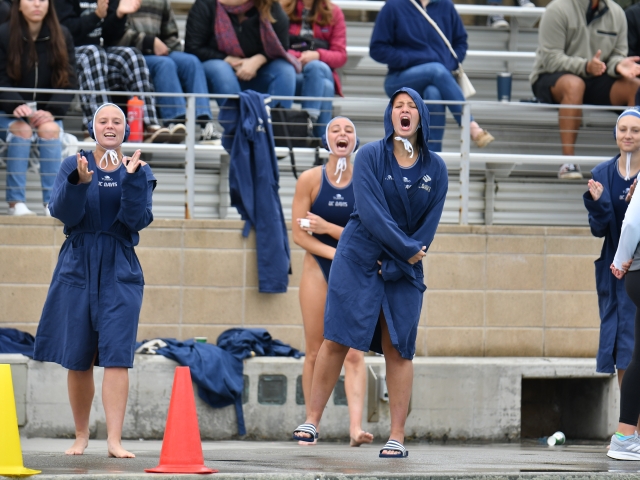 UC Davis Water Polo team cheers on others in a match