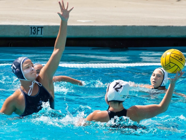 Two water polo players in the water