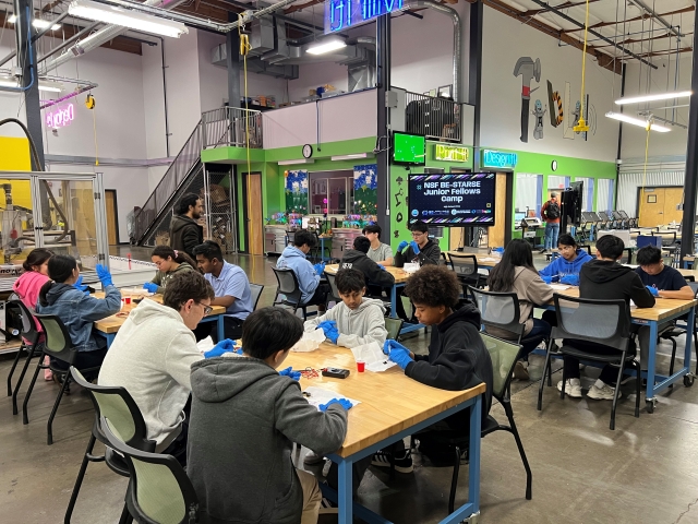 Middle school students collaborate on STEM projects in a makerspace
