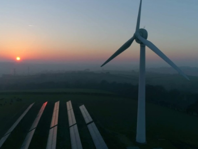 Windfill with a field in background