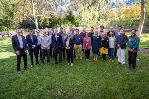 NCIBT Group Stands in grass for group photo