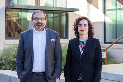 Irfan Siddiqi and Marina Radulaski stand outside