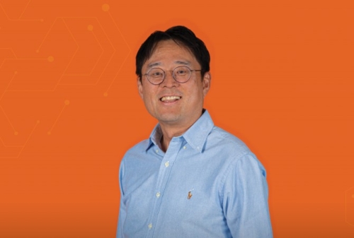 Photo of Jae Wan Park, CEO of RePurpose Energy and UC Davis professor of mechanical and aerospace engineering, against orange background