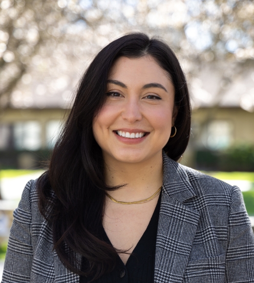 Headshot of Elizabeth Ortega with trees in the background