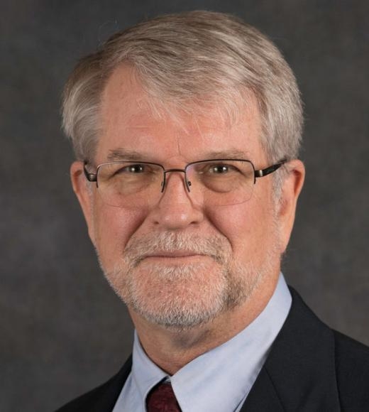 A headshot of David Fyhrie