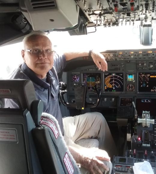 James Baughn in the cockpit of an aircraft