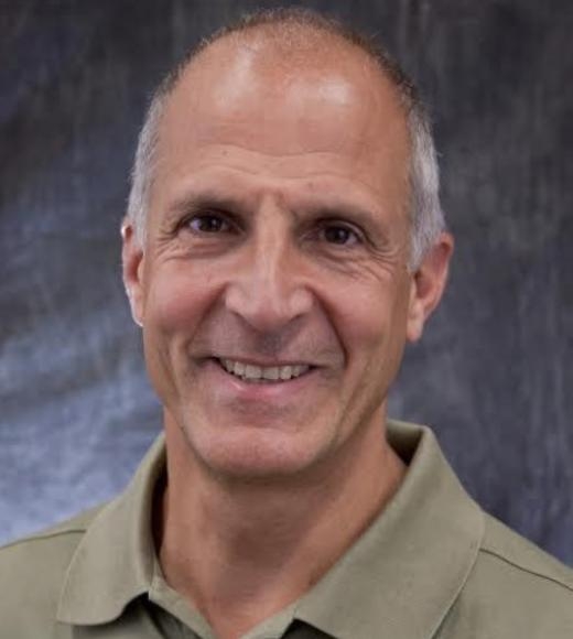 A headshot of Mark Modera