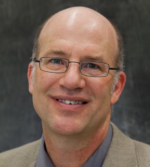 A headshot of Greg Miller