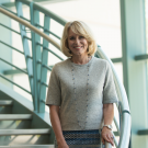 Diane Bryant (’85) on the spiral staircase of Kemper Hall