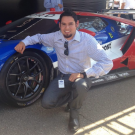 Jose Velazquez with an electric vehicle