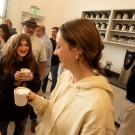 Phoebe Sothern, art studio and history major, and Daisy Moore, a communications major, talk over their newly made lattes during the coffee class at the Coffee Center 
