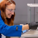 Cassondra Brayfield in a lab with blue lab coat on