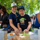A mother and her son playing with slime