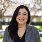 Headshot of Elizabeth Ortega with trees in the background