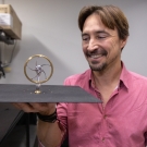 Professor Jeremy Munday holds device