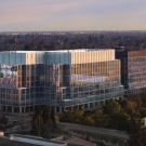 A large building in Sacramento on the UC Davis campus with many glass windows called Aggie Square