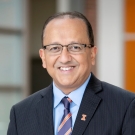 A portrait of Rashid Bashir in a suit