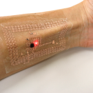 arm with temporary tattoo that displays health information