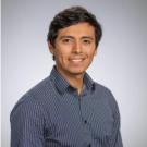 Luis Ceferino wearing a striped shirt against a light background.
