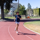 Zachary Graeber runs on a track at UC Davis