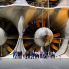 Society stands in front of the rotors of the largest wind tunnels in the world